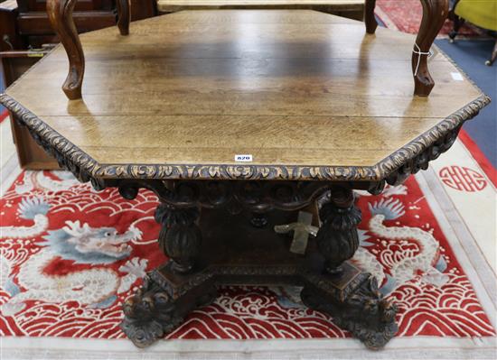 A Victorian carved oak octagonal extending dining table, W.122cm